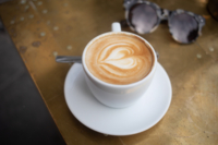 Cappuccino and sunglasses in a caf&eacute; in Munich.