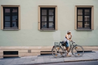 Cyclist with ice-cream during summertime in Munich
