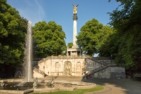 Park with fountains and stone steps at the Friedensengel in Munich.