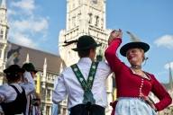 Traditional Bavarian dancers in front of New Town Hall at Munich Marienplatz