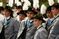 A group of young men dressed in traditional costumes at the Oktoberfest in Munich.