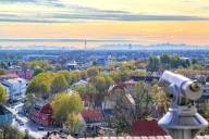 View from Dachau's Schlossberg, with the Alps and Munich's Olympic Tower visible in the background.