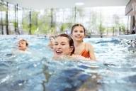 A family in the wave pool at the Cosima Wave Pool in Munich.