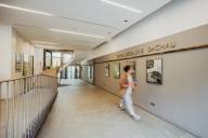 A visitor walks through the corridor of the picture gallery in Dachau.