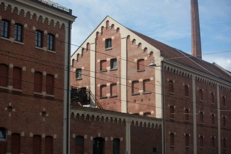 The historic building of the Augustiner Brewery is made of red brick.