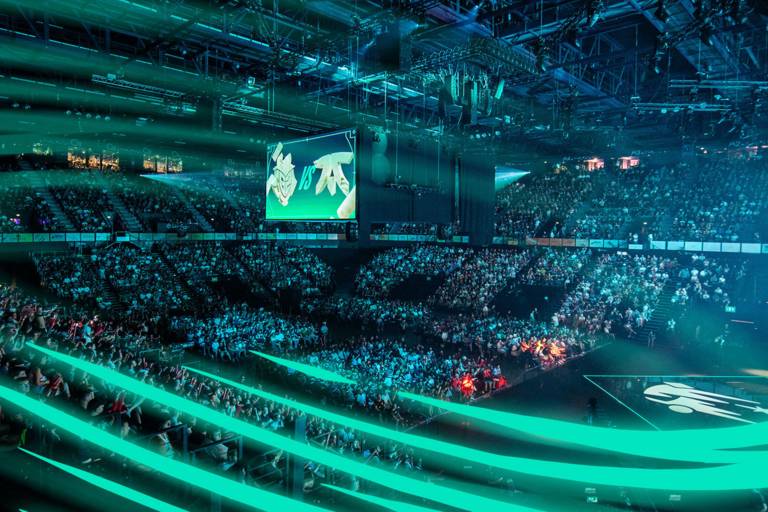 Interior of a hall in which spectators watch League of Legends.