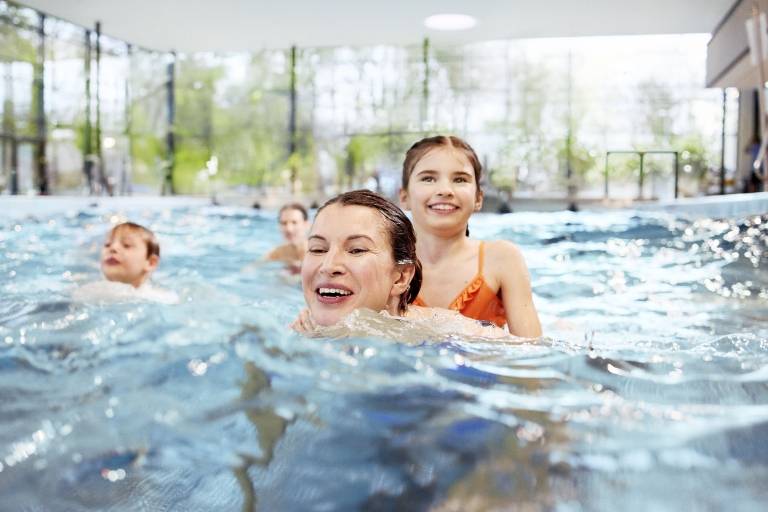 A family in the wave pool at the Cosima Wave Pool in Munich.